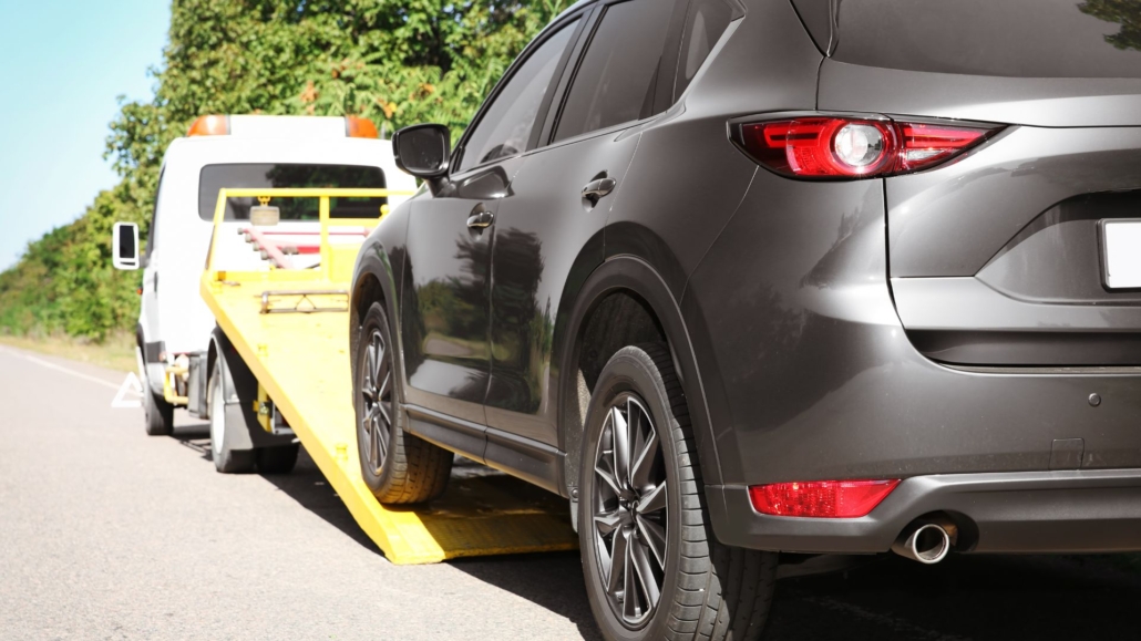 car being loaded on a tow truck